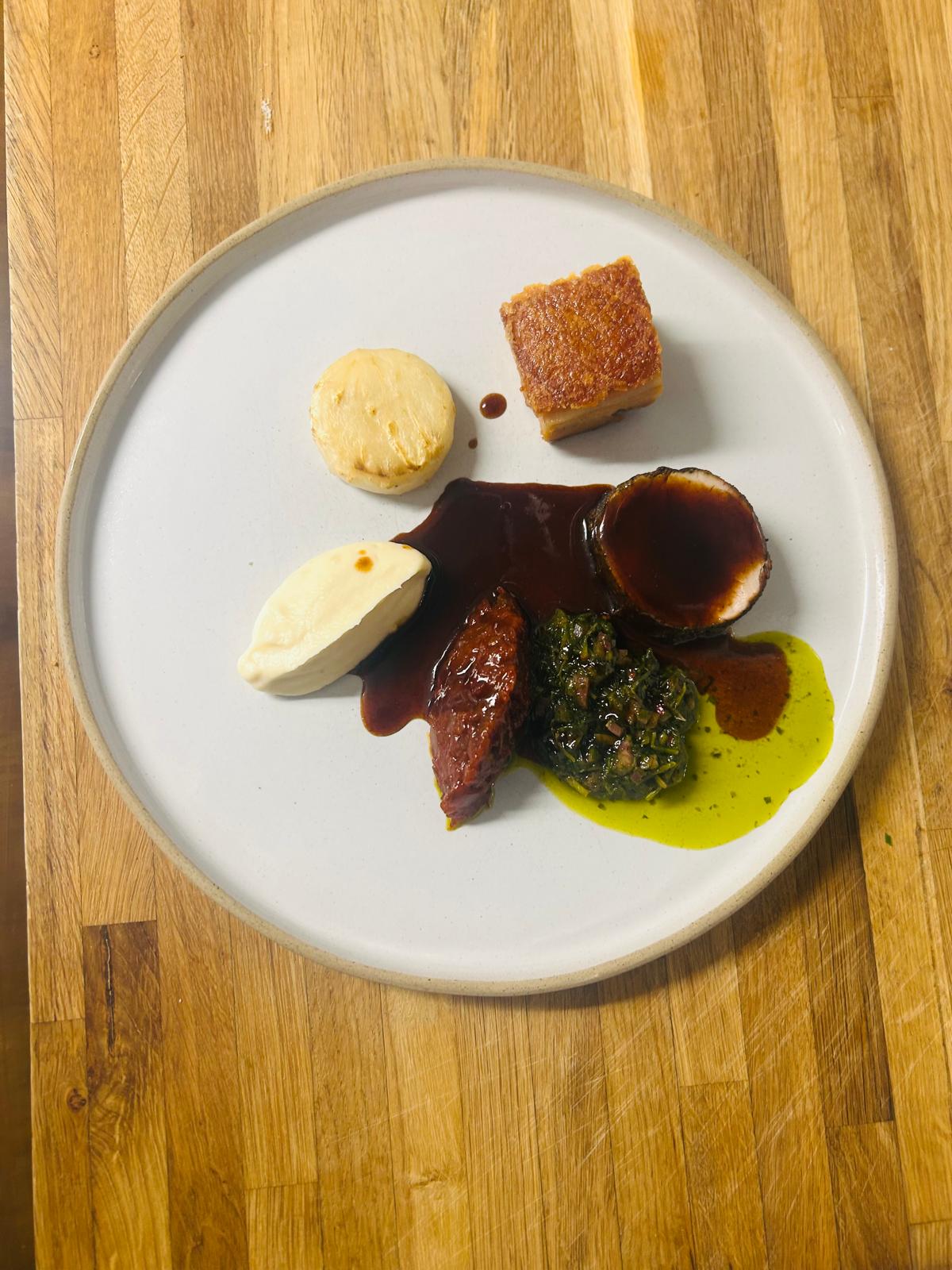 Crispy pork belly with celeriac purée and salsa verde